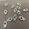 Natural Mother of pearl hand shape cutting evil eyes necklace design making fatima hands for chain using small beads design